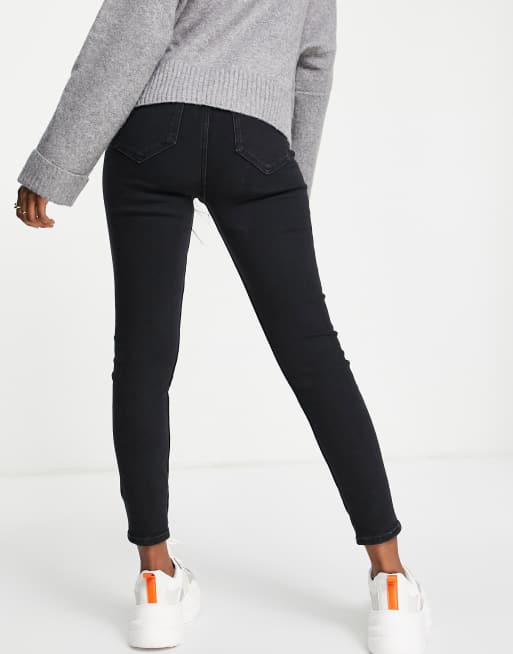 Vaqueros pitillo de tiro River Island |