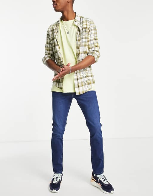 Vaqueros pitillo en azul Bryson de Wrangler