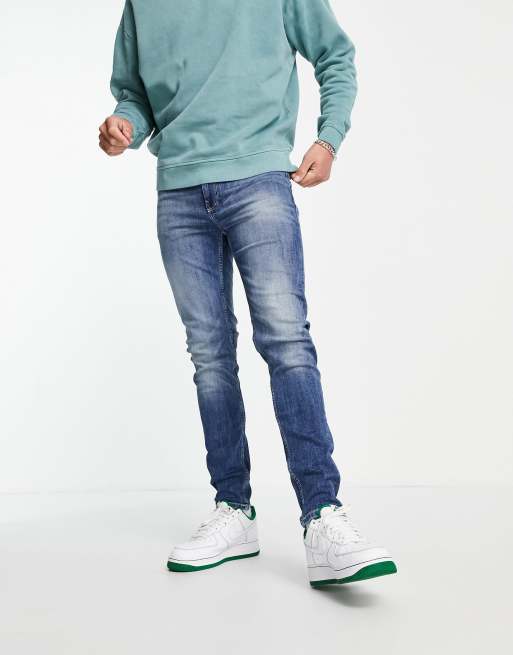 Vaqueros pitillo en azul lavado medio de ASOS DESIGN