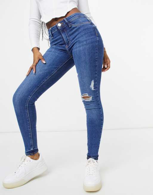 Vaqueros pitillo en azul medio auténtico rasgados Molly de River Island