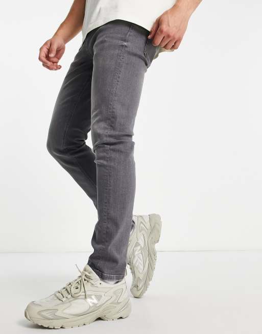 Vaqueros pitillo grises de River Island