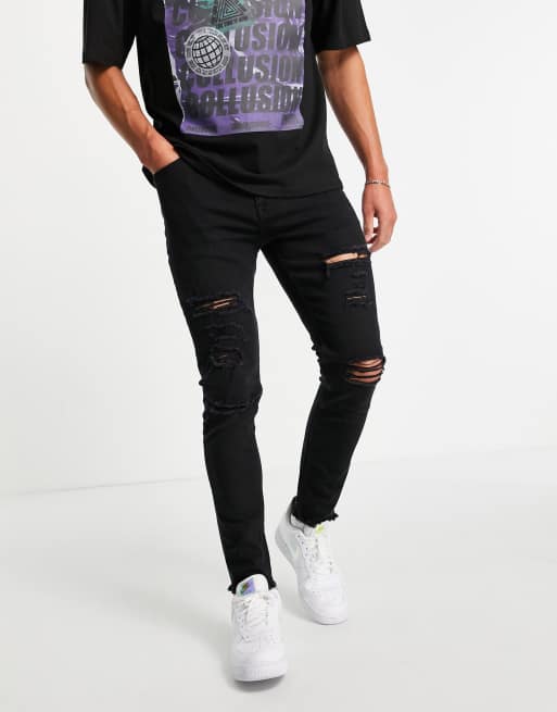 Vaqueros pitillo negros con roturas exageradas y bajos sin rematar de ASOS DESIGN