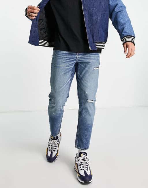 Vaqueros rígidos clásicos con lavado medio y abrasiones de ASOS DESIGN