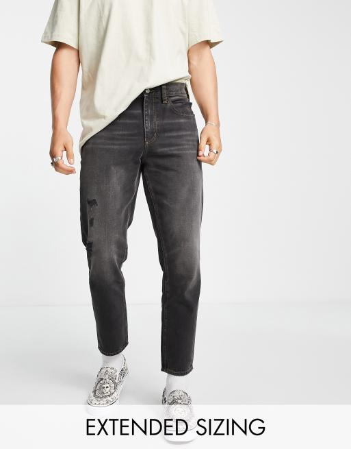 Vaqueros rígidos clásicos en negro desgastado con abrasiones de ASOS DESIGN 