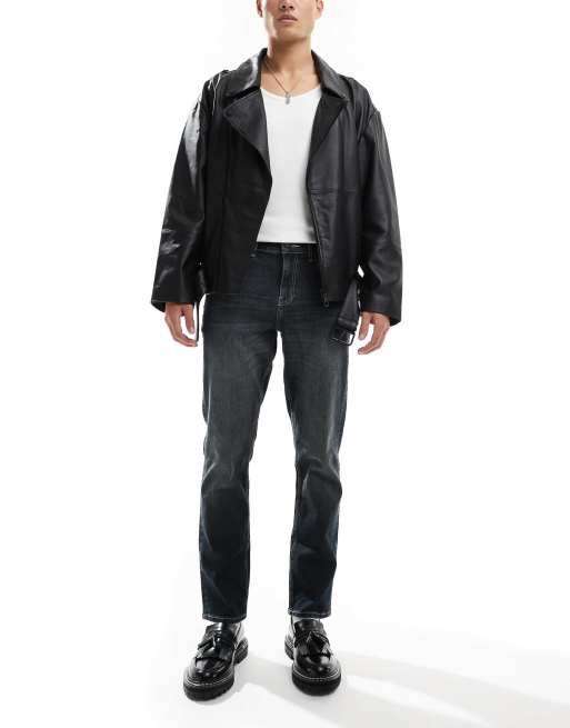 Vaqueros slim elásticos con lavado oscuro vintage de ASOS DESIGN