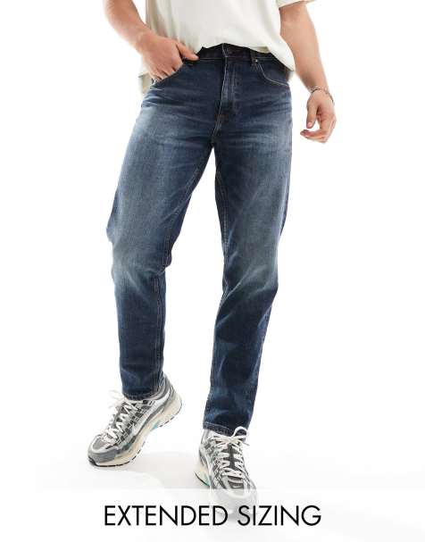 Vaqueros tapered azules con lavado oscuro de corte elástico de ASOS DESIGN - view 1