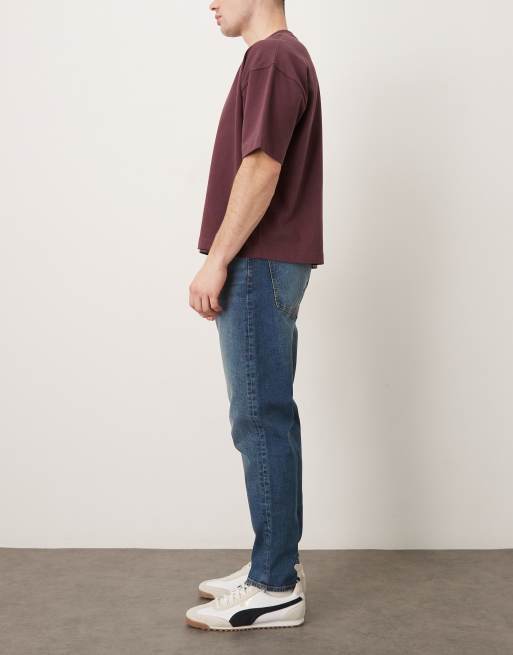 Vaqueros tapered con lavado azul oscuro de ASOS DESIGN, 2 de 5