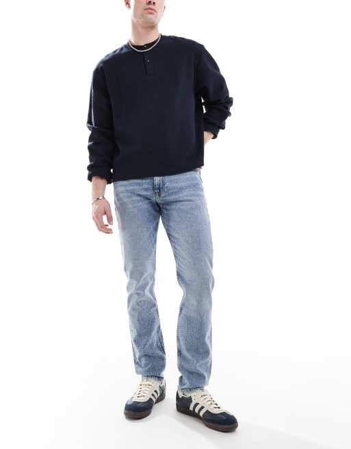 Vaqueros tapered de corte slim con lavado claro de Calvin Klein Jeans