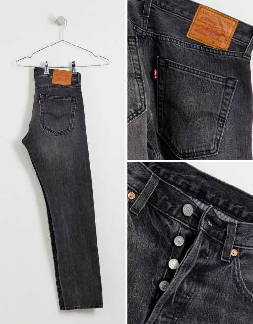 Vaqueros tapered de corte slim y tiro bajo en gris descolorido