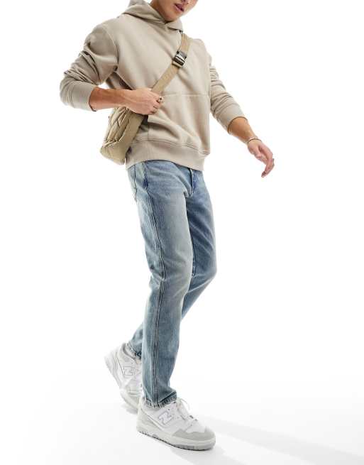 Vaqueros tapered en azul claro de River Island
