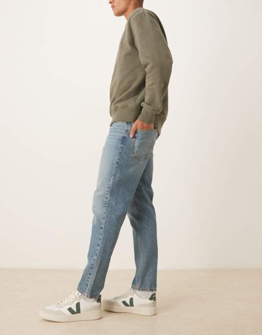 Vaqueros tapered en azul lavado medio de ASOS DESIGN, 3 de 5