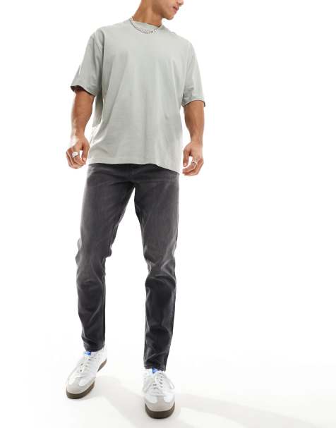 Vaqueros tapered en negro desgastado de ASOS DESIGN - view 1