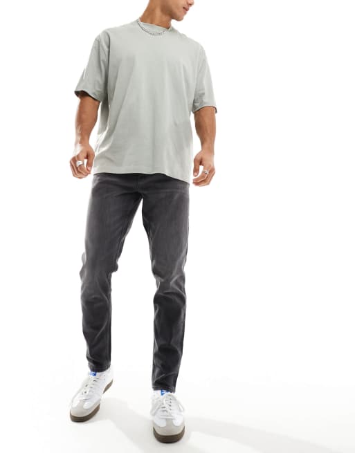 Vaqueros tapered en negro desgastado de ASOS DESIGN