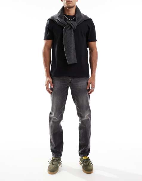 Vaqueros tapered en negro desgastado de corte elástico de ASOS DESIGN - view 1