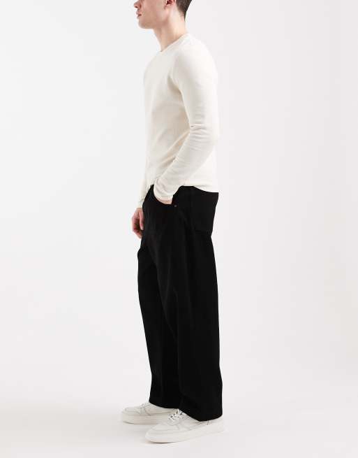 Vaqueros tapered holgados en negro de ASOS DESIGN, 2 de 5