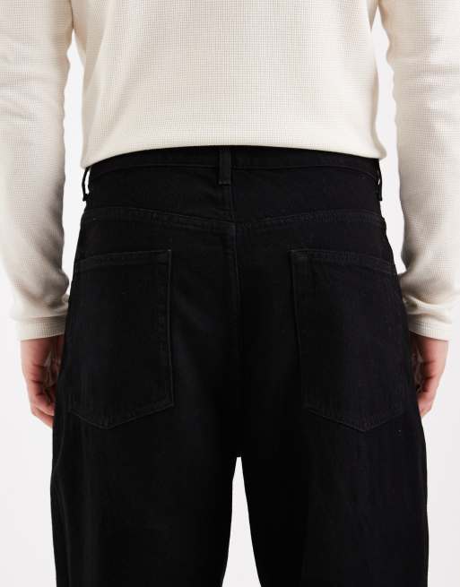 Vaqueros tapered holgados en negro de ASOS DESIGN, 4 de 5