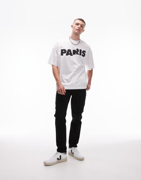 Vaqueros tapered negros elásticos de Topman - view 1