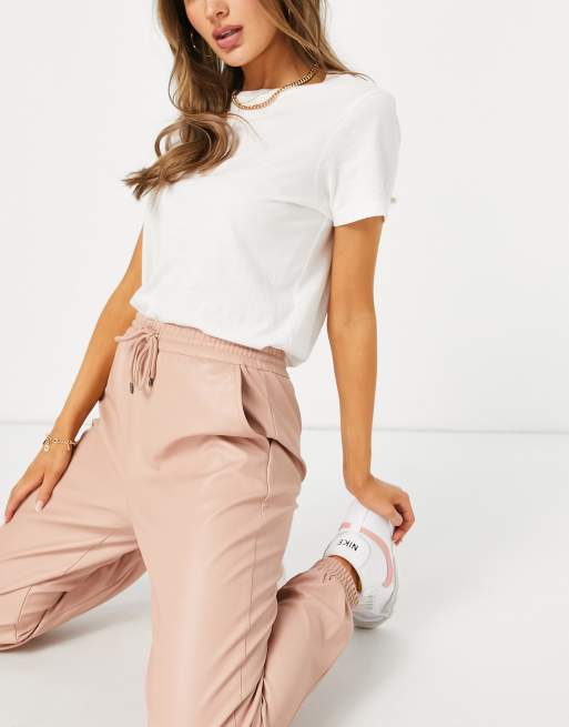 Vero Moda coated trackies in blush