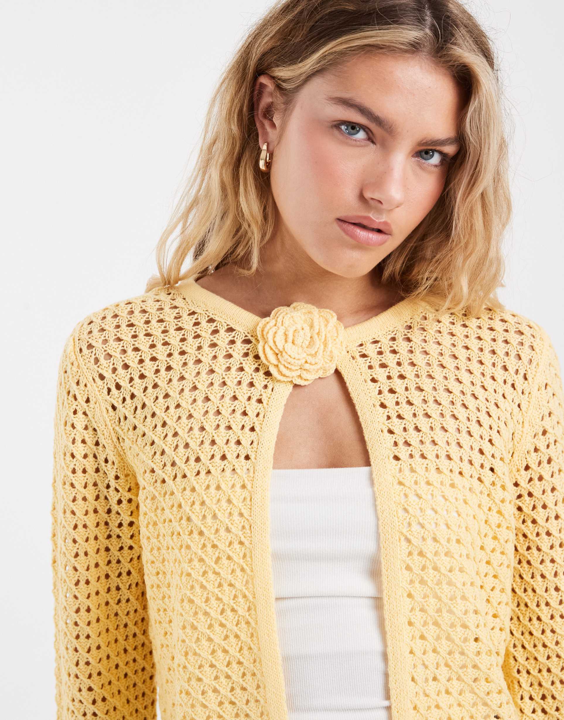 vero moda crochet knit cardigan with floral corsage in golden yellow