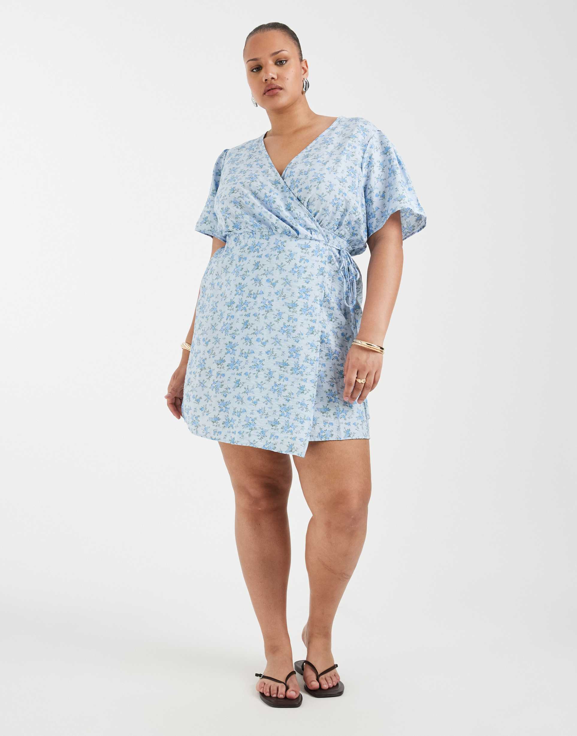 vero moda curve flutter sleeve wrap front mini dress in blue floral print