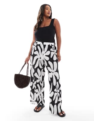 high waist wide leg plisse pants in tropical conversational print-Black