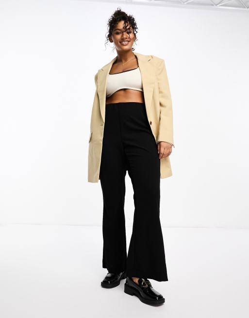 Vero Moda Curve jersey flare pants in black