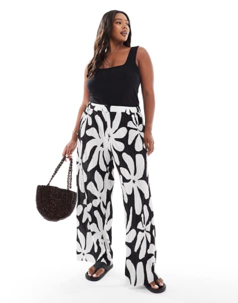 Vero Moda Curve high waist wide leg plisse trouser in tropical conversational print