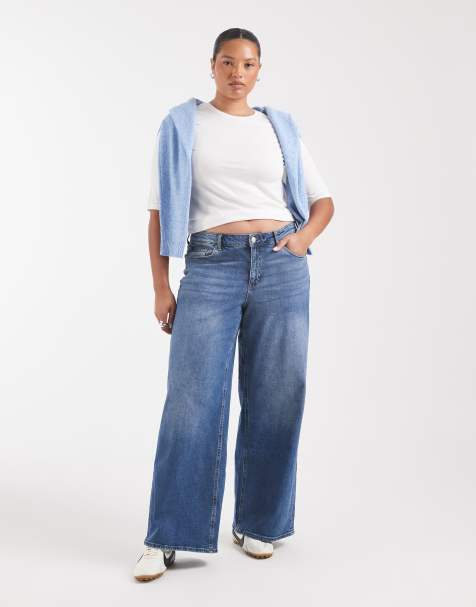 Vero Moda Curve Sandie jeans z średnim stanem, szerokimi nogawkami i stretchem w średnim niebieskim denimie - view 1