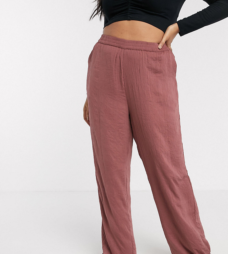Plus-size trousers by Vero Moda Throw on and go High rise Stretch waistband Side pockets Wide leg Regular fit on the waist