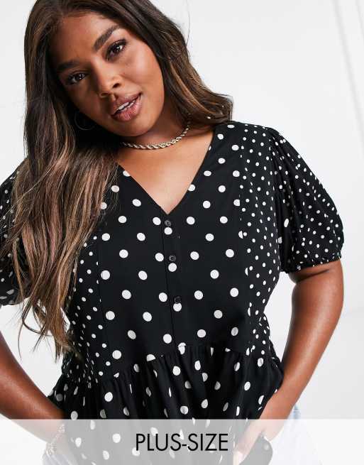 Vero Moda Curve - Sort peplum-bluse med hvide polkaprikker 