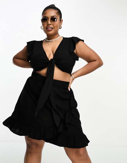 Vero Moda Curve – Svart minikjol i linnestil med omlottdesign och volang