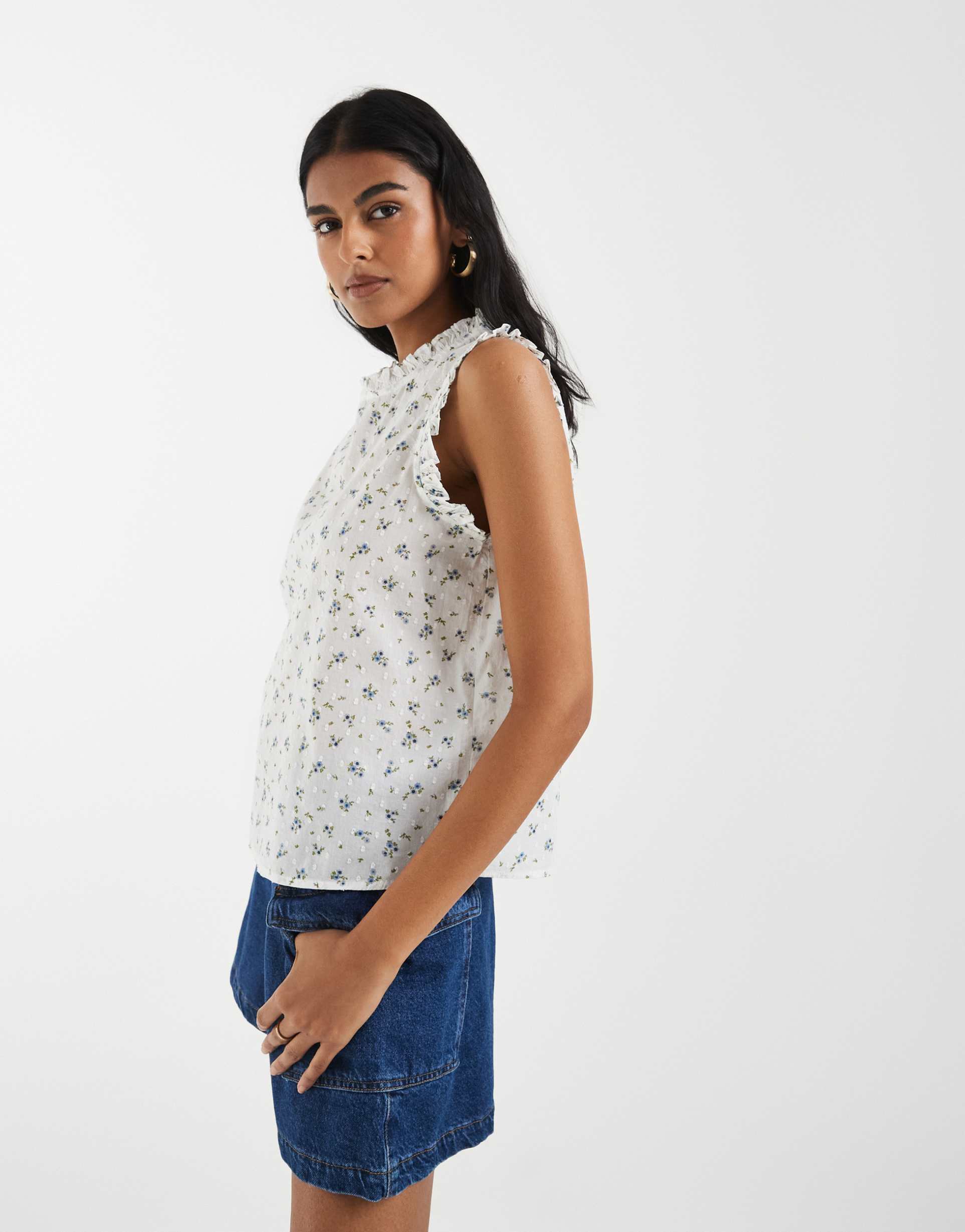 vero moda dobby texture ruffle trim sleeveless top in white and blue floral print