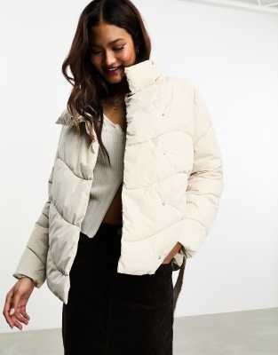 Vero Moda funnel neck padded jacket with belt in cream-White