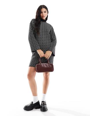 Shop Vero Moda geo knitted mini dress in black with mono print Online – Trendy & Affordable Fashion