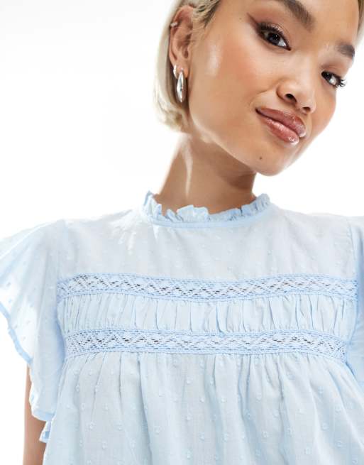 Vero Moda high neck flutter sleeved embroidered top in blue