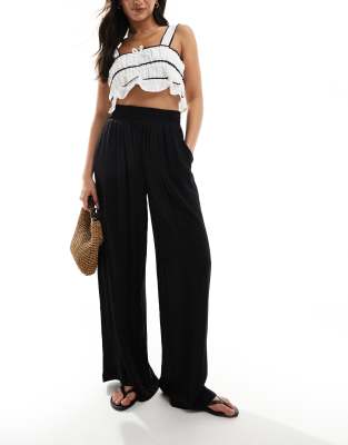 Vero Moda high waisted floaty wide leg trousers in black