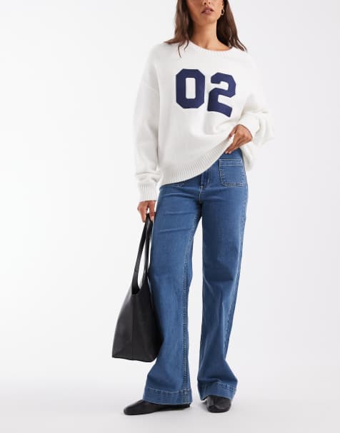Vero Moda Kayla jeans anchos de talle alto con detalle de bolsillo en denim azul medio - view 1