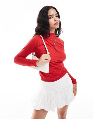 long sleeved ruched jersey top in cherry red