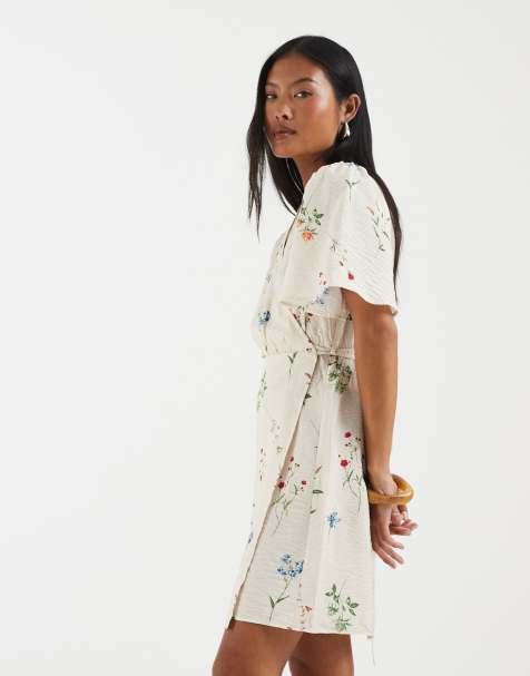 Vero Moda Petite flutter sleeve wrap front mini dress in cream floral print - view 1