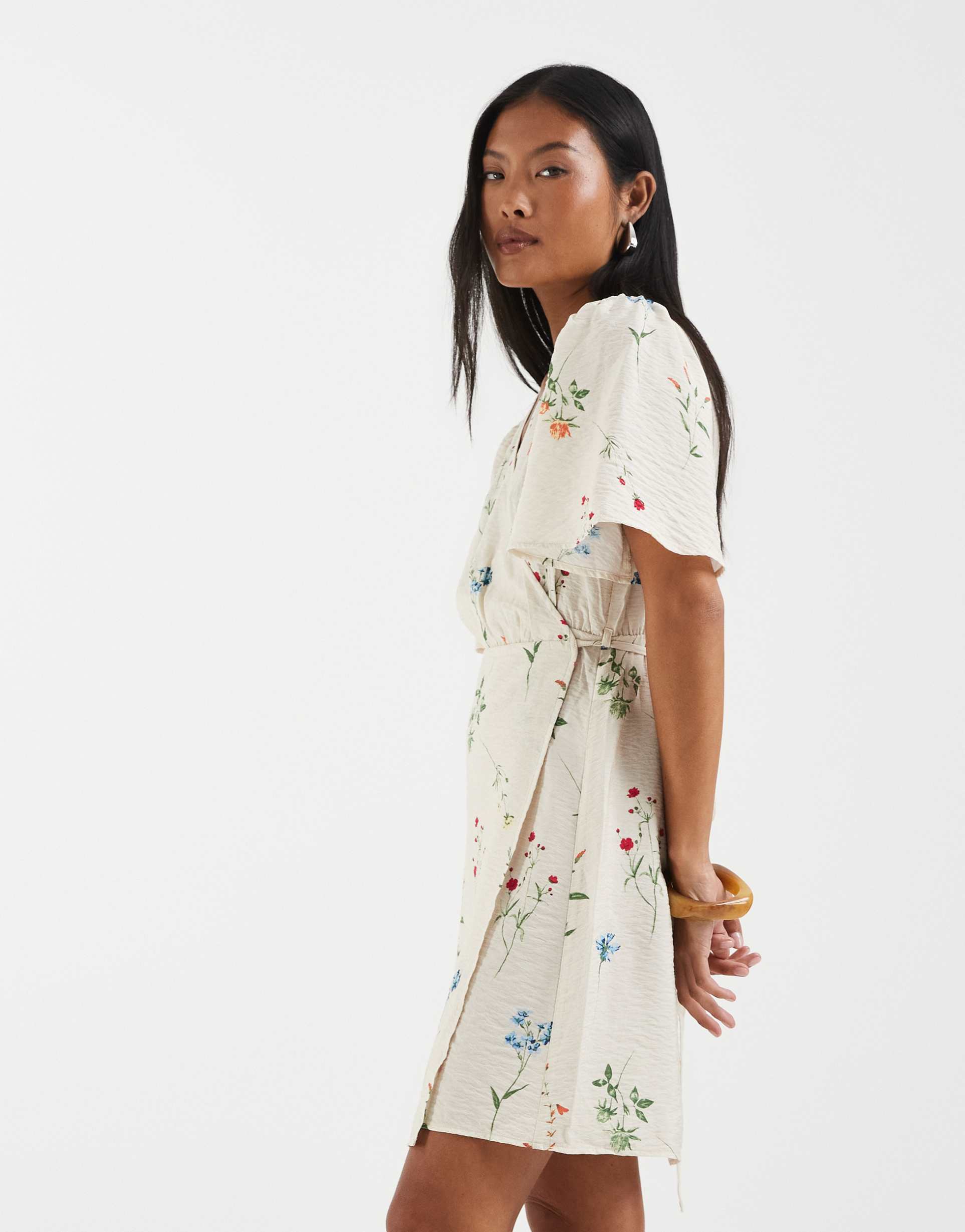 vero moda petite flutter sleeve wrap front mini dress in cream floral print