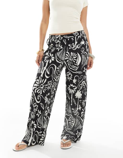 Vero Moda Petite high rise wide leg plisse pants in tropical conversational print