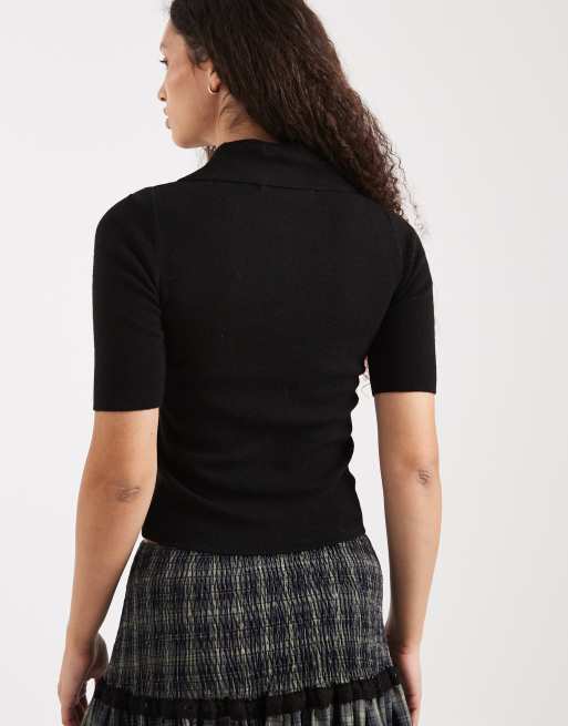 Vero Moda - Polo nera in maglia strutturata con mezze maniche e bottoni sul davanti, 3 di 4