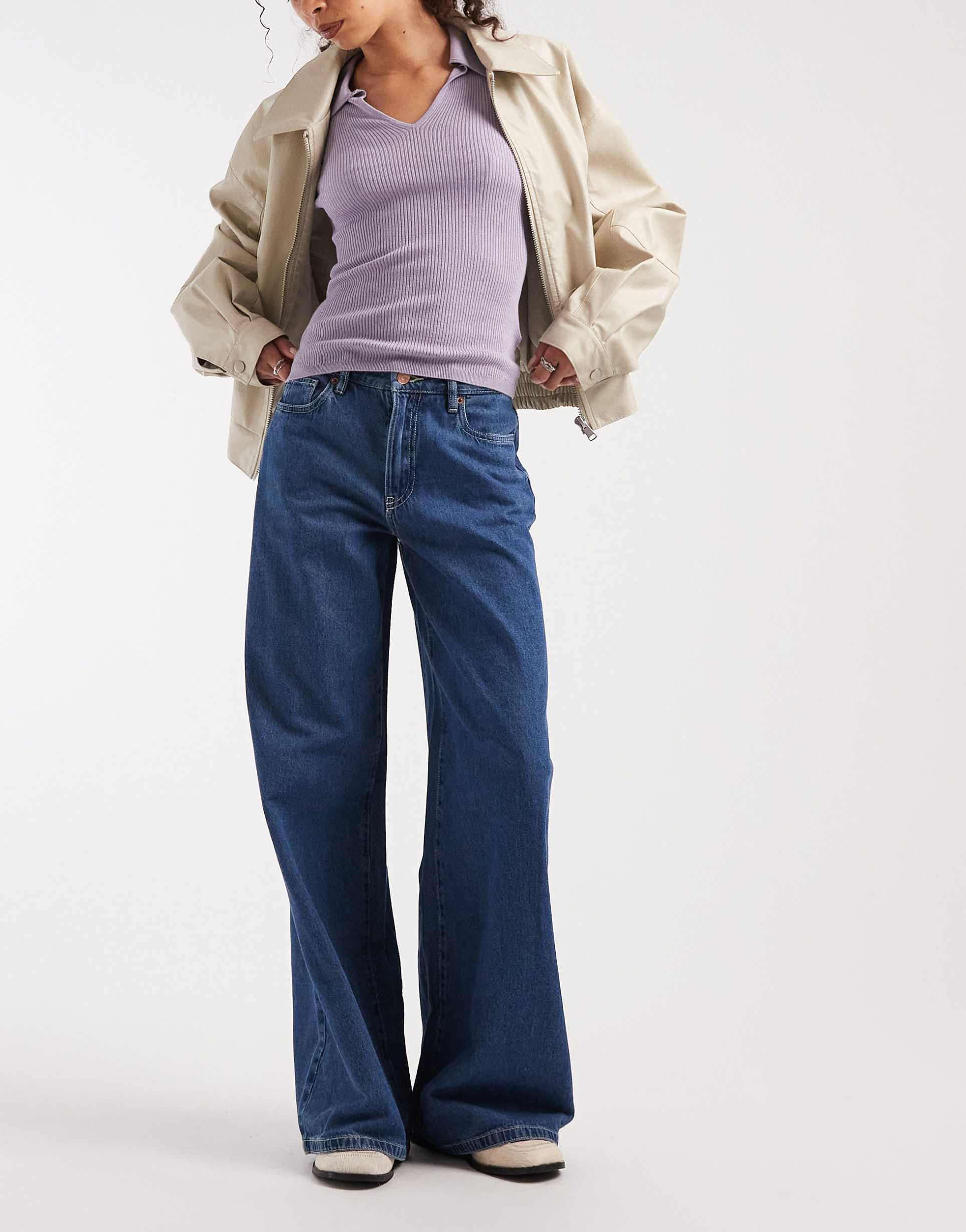 vero moda remy mid rise wide leg jeans in medium blue denim