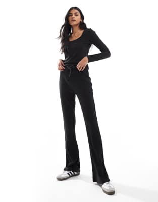 ribbed jersey flared pants in black - part of a set