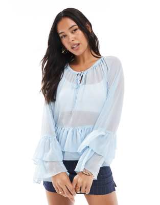 ruffle hem boho style top in soft blue