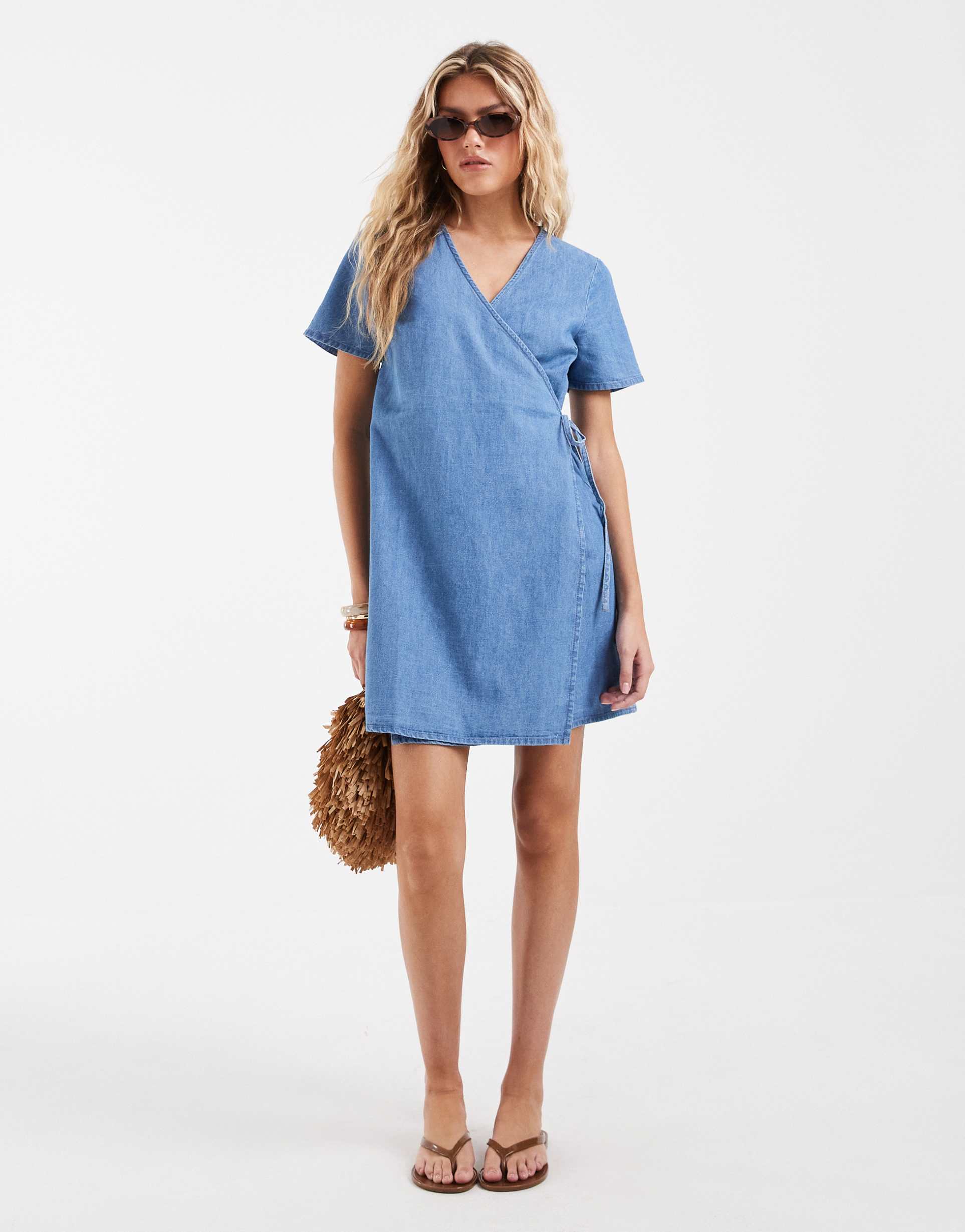 vero moda short sleeve wrap front denim mini dress in light blue wash