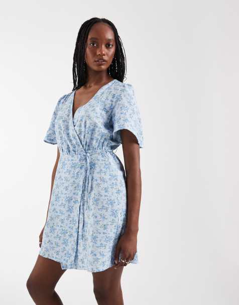 Vero Moda Tall flutter sleeve wrap front mini dress in blue floral print - view 1