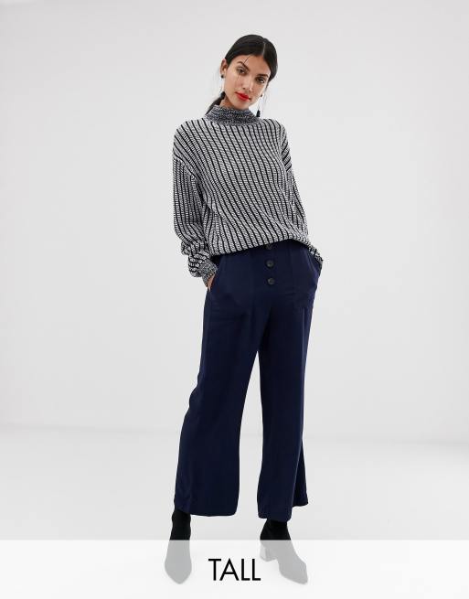 Navy kick flare store trousers