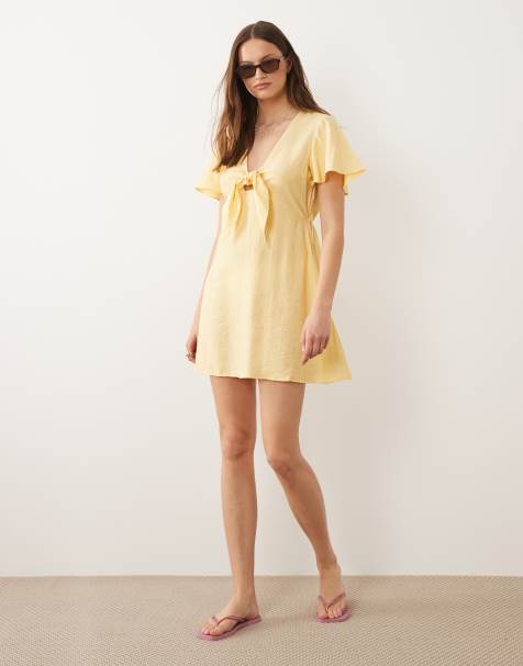 Vero Moda Tall - Vestido corto amarillo dorado con lazada delantera de tejido texturizado rugoso - view 1