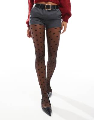 tights with large spot print in black